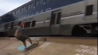 Skateboarders attempting dangerous tricks nearly get hit by train