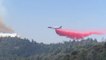 Air Tanker Dumps Fire Retardant Over Wildfire in California