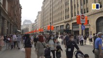 Crowds pack streets in Shanghai as China's annual 'golden week' holiday kicks off on National Day