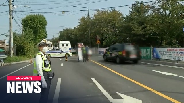 Protesters hold 'drive-thru' rallies amid heavy police presence