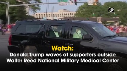 Donald Trump waves at supporters outside Walter Reed National Military Medical Center