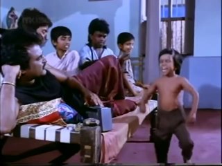 Breakdancing midget scene from Adhisaya Piravi 2020.