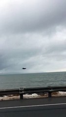 Eagle Flies Alongside Driver in Alaska