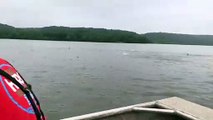 1000s of fishes jumping out of water near boat VID ID - VIDID