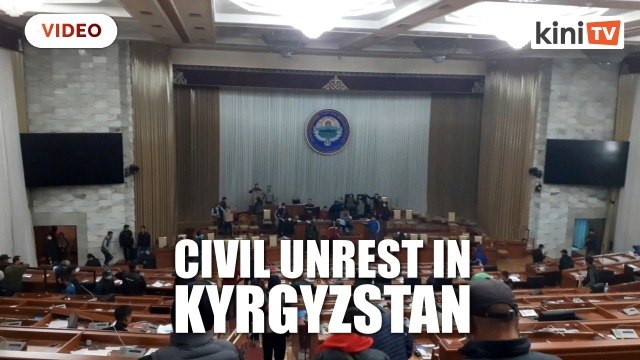 Kyrgyzstan on edge of chaos after opposition storms government buildings