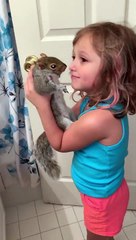 Squirrel Loves Being Held by His Best Friend