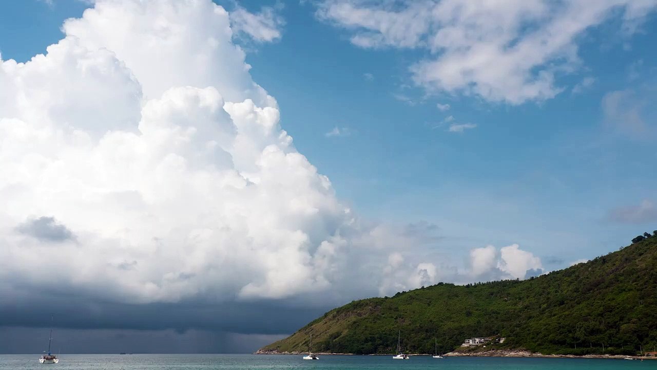 Clouds arriving at the beach Aerial shot over a sandy coastline natural beautiful royalty Free Stock no copyright video Free for commercial use dron dron aerial view