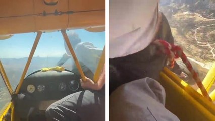 Il sort du cockpit de l'avion pour redémarrer le moteur