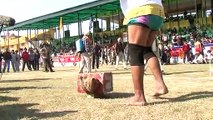Old man Hulk lifts a heavy weight at Kila Raipur Rural Olympics