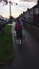 'Captain Tobias' practising on his new trike bought by Sheffield firm Jiraffe