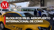 Taxistas bloquean accesos a terminales 1 y 2 del AICM