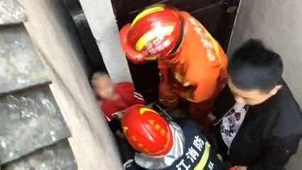 Firefighters free boy’s head from narrow gap in China