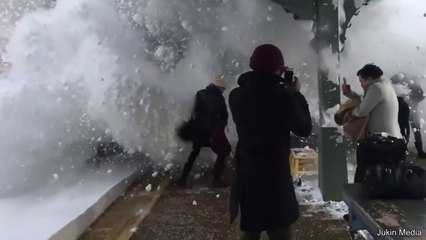 Train Pushes Wave Of Snow At People