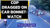 Cop dragged on bonnet of car in Delhi | Caught on camera | Oneindia News