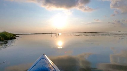 Kayak camp overnight on a floating platform. No talking.