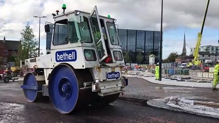 Workmen prepare for the opening of the new road in the Adelphi Quarter next to UCLan