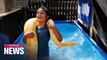 8-year-old Israeli girl swims with her 11-foot long pet python