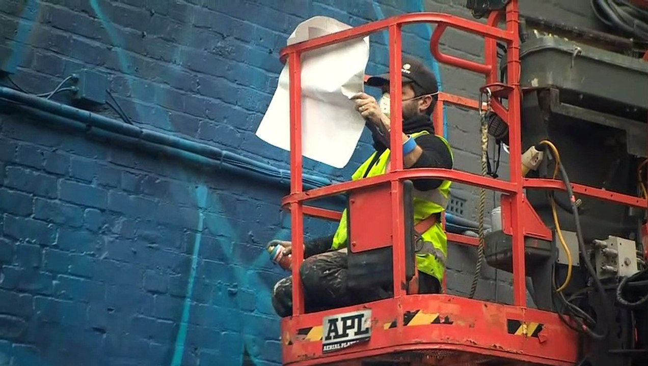 Manchester mural adapted from NHS worker portrait