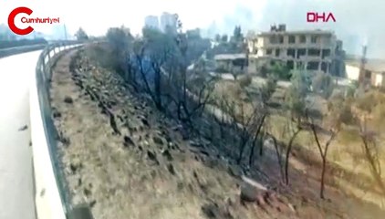 Hatay'daki yangın bölgesi yakınında 'Ne varsa yansın' yazısı