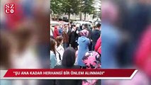 İlkokulun önünde çocuklarını bekleyen veliler sosyal mesafeyi hiçe saydı