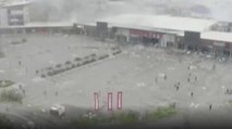 People looted the burning mall in Nigeria