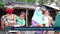 Polisi Bagikan Nasi Kotak di Tengah Pandemi