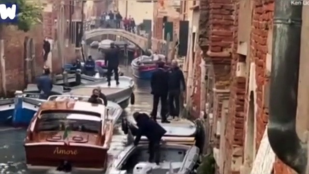 Tom Cruise jumping from a boat in the set of Mission Impossible 7