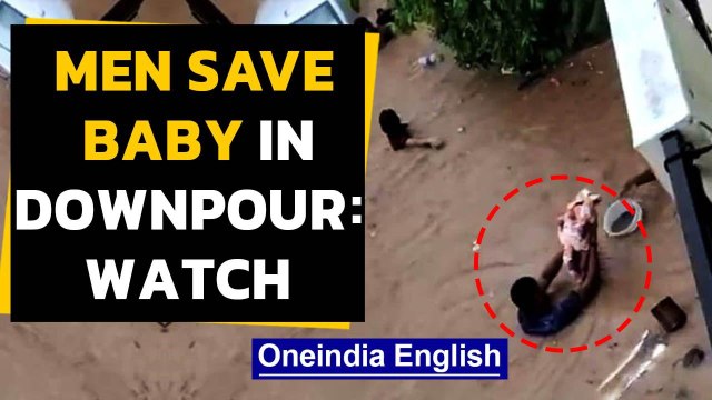 Bengaluru rains: Viral video shows men rescue baby | Oneindia News