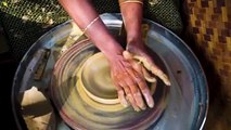 woman-making-clay-pot-in-kerala-india