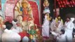Kolkata: Devotees in PPE kit gives farewell to Maa Durga