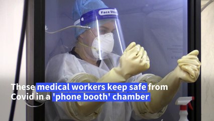 Malaysian doctors test patients for Covid-19 in 'phone booth' chamber