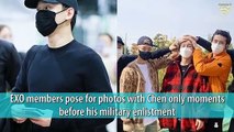 EXO members pose for photos with Chen only moments before his military enlistment