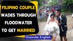 Filipino couple wades through floodwater to get married, pics go viral|Oneindia News