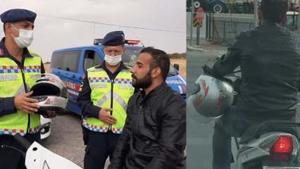 Dakikalar önce uyarıldı, hediye edilen kaskı başına değil koluna taktı