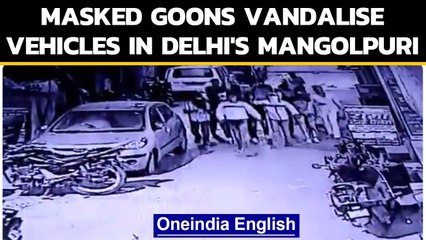 Download Video: Delhi: CCTV footage showing masked men carrying weapons, vandalising vehicles surfaces|Oneindia News