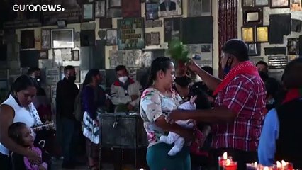 Guatemalans make offerings to folk hero San Simon for COVID protection