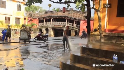 Residents clean up after typhoon leaves behind mess