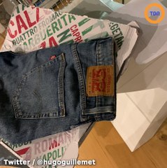 Il reçoit son jean commandé sur Vinted dans une boîte à pizza