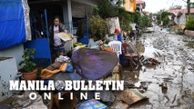 Filipinos return to mud-soaked homes after Typhoon Rolly