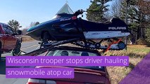 Wisconsin trooper stops driver hauling snowmobile atop car, and other top stories in strange news from November 07, 2020.