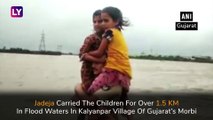 Gujarat Floods: Police Constable Rescues Two Children By Carrying Them On His Shoulders