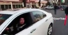 Tashkent traffic police officers presented women with chocolate bars