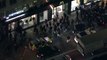 Live- Aerials of 'million mask' march in London