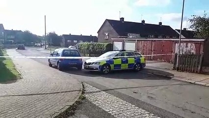 Police at the scene following the murder of a 16-year-old boy in Corby