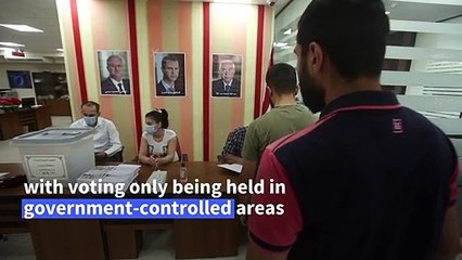 War-ravaged Syria votes with Assad set to win