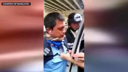 Manila police arrest a 26-year-old woman after assaulting a traffic enforcer