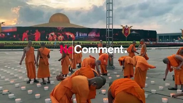 Buddhist monks light candles on Visakha Bucha Day