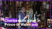 Charles pulls a pint in Prince of Wales pub