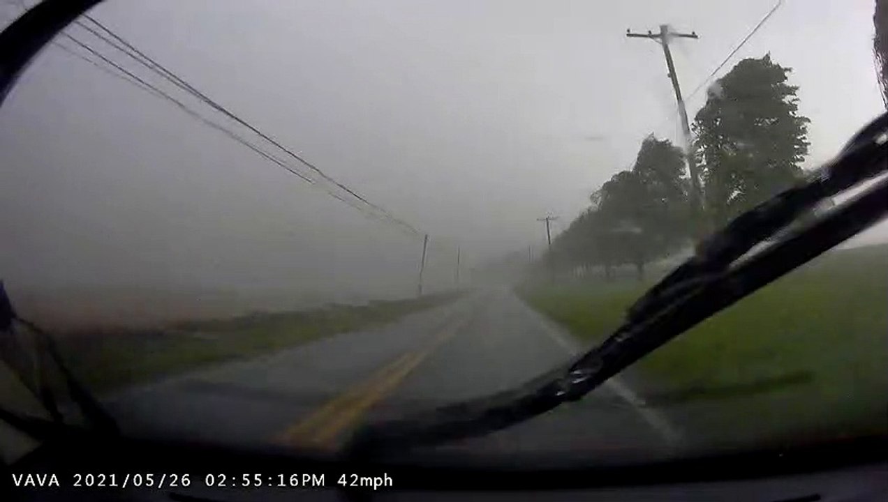 Strong Storms Push Power Lines Onto Road