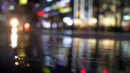 Slow Motion Raindrops in City Night